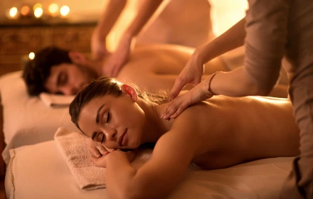 Person receiving a professional massage on a portable massage bed in an apartment in Dubai JBR.