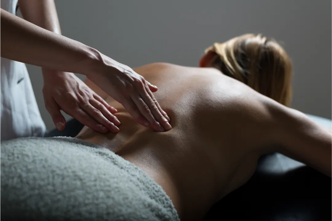 This person is geting Deep Tissue Massage on a portable Massage bed in his apartnent in dubai.