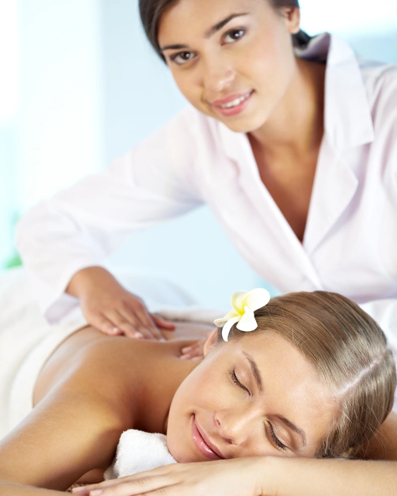 Person receiving a professional massage on a portable massage bed in an apartment in Home Massage in Bur Dubai