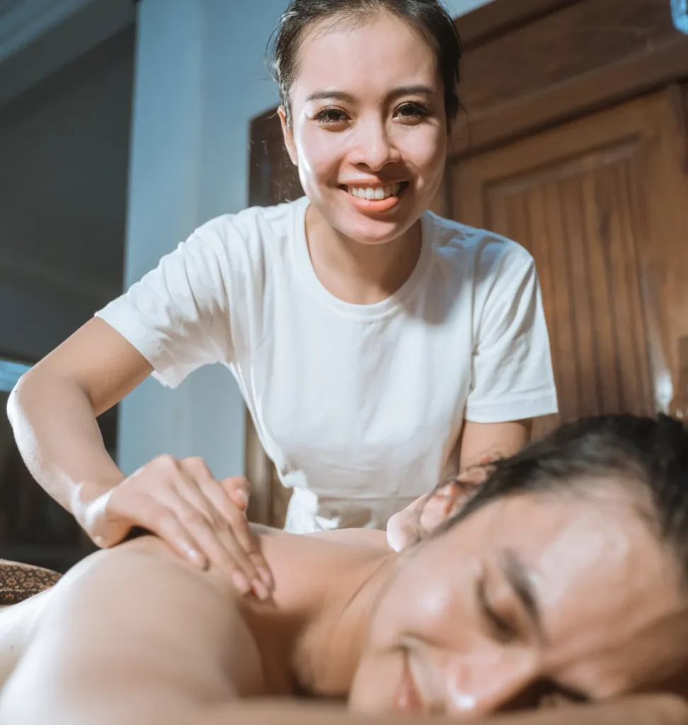Person receiving a professional massage on a portable massage bed in an apartment in Home Massage in Person receiving a professional massage on a portable massage bed in an apartment in Home Massage in Dubai Media City