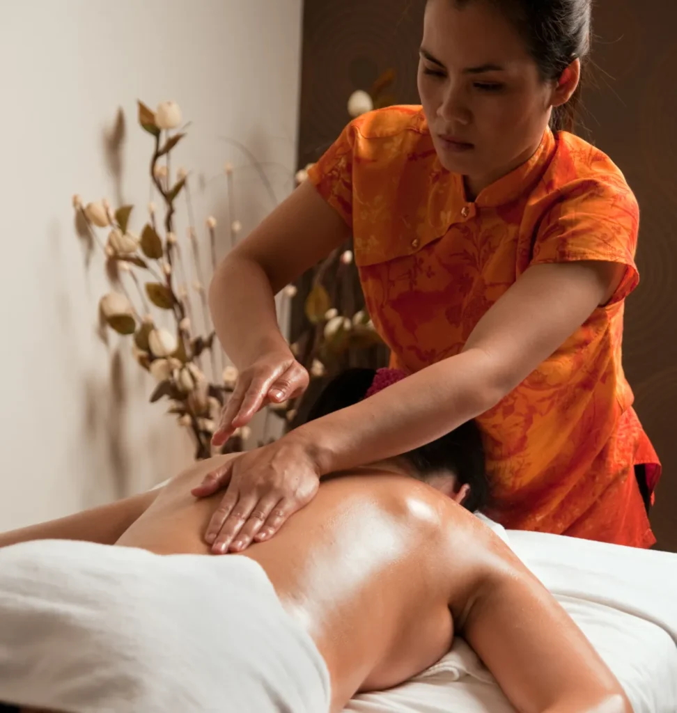 Person receiving a professional massage on a portable massage bed in an apartment in Home Massage in Person receiving a professional massage on a portable massage bed in an apartment in Home Massage in Arabian Ranches