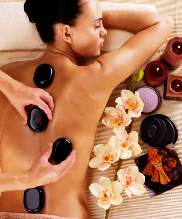 Person receiving a professional massage on a portable massage bed in an apartment in Home Massage in Person receiving a professional massage on a portable massage bed in an apartment in Home Massage in Arabian Ranches