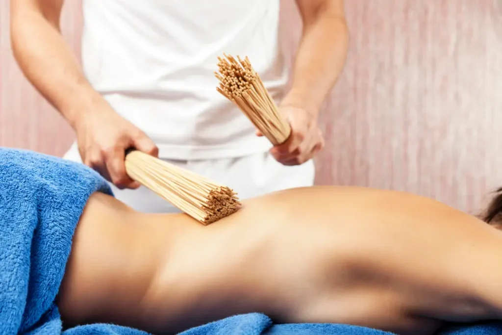 Person receiving a professional massage on a portable massage bed in an apartment in Home Massage in Dubai Hills