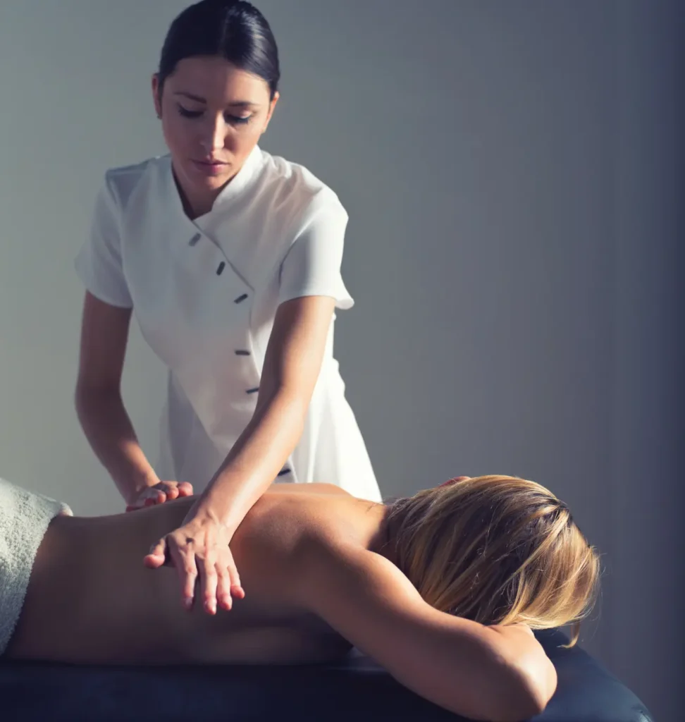 Person receiving a professional massage on a portable massage bed in an apartment in Home Massage in Dubai Hills