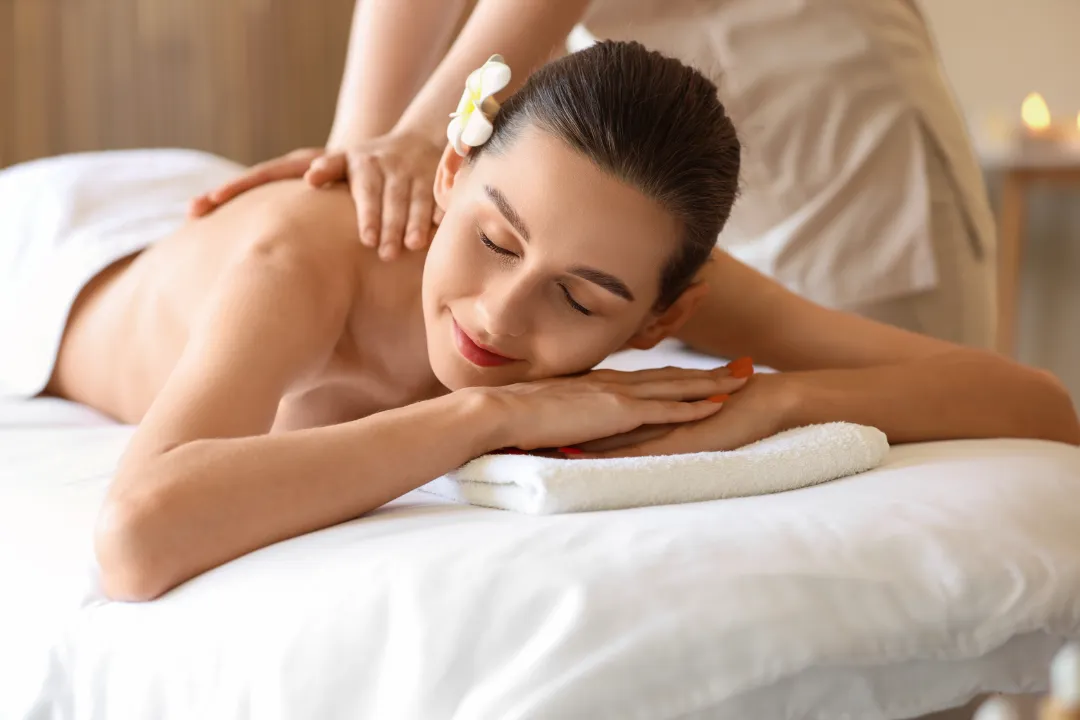 This person is geting Hot Stone Massage on a portable Massage bed in his apartnent in dubai.