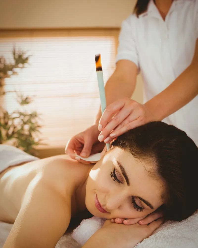 This person is geting Hot Stone Massage on a portable Massage bed in his apartnent in dubai.