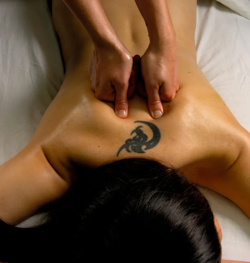 This person is geting Sports Massage on a portable Massage bed in his apartnent in dubai.