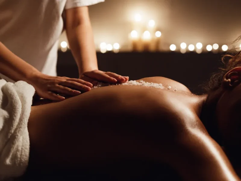 Person receiving a professional massage on a portable massage bed in an apartment in Home Massage in Person receiving a professional massage on a portable massage bed in an apartment in Home Massage in Al Quoz