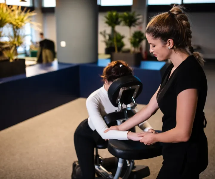 Person receiving a professional massage on a portable massage bed in an apartment in Home Massage in Person receiving a professional massage on a portable massage bed in an apartment in Home Massage in Dubai Media City