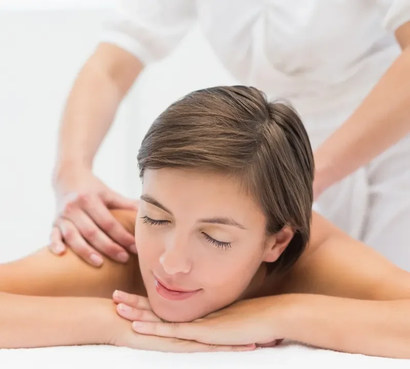 Person receiving a professional massage on a portable massage bed in an apartment in Home Massage in Person receiving a professional massage on a portable massage bed in an apartment in Home Massage in Dubai Media City