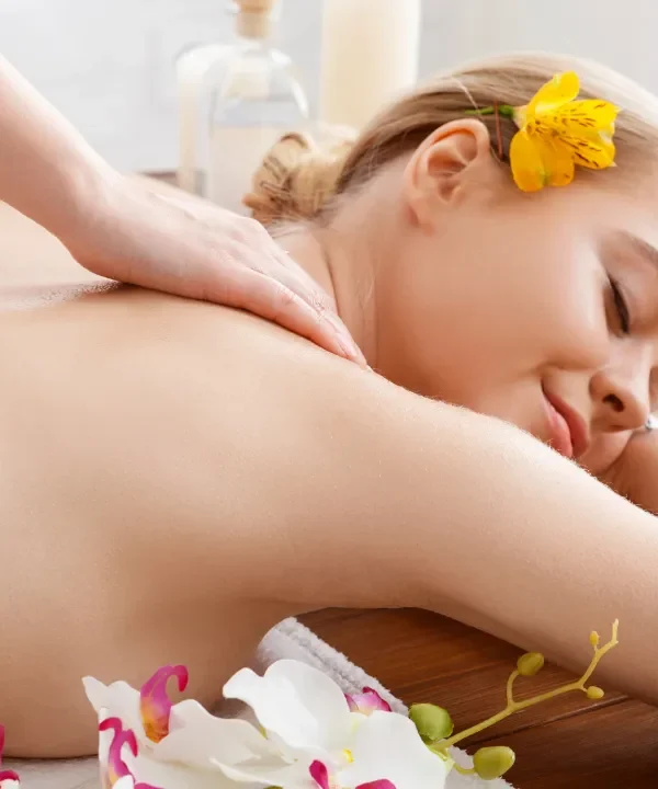 Person receiving a professional massage on a portable massage bed in an apartment in Home Massage in Mirdif