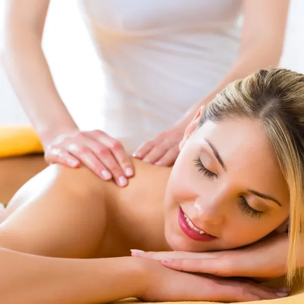 Person receiving a professional massage on a portable massage bed in an apartment in Home Massage in Person receiving a professional massage on a portable massage bed in an apartment in Home Massage in Arabian Ranches