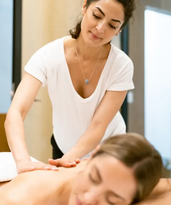 Person receiving a professional massage on a portable massage bed in an apartment in Home Massage in Person receiving a professional massage on a portable massage bed in an apartment in Home Massage in Motor City