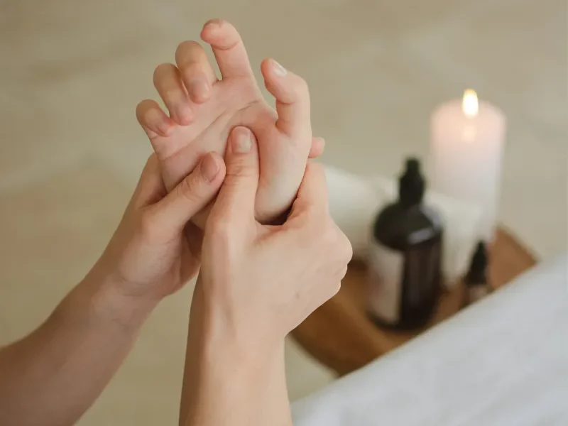 This person is geting Hot Stone Massage on a portable Massage bed in his apartnent in dubai.