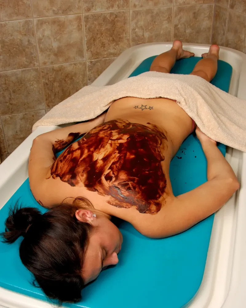 This person is geting Sports Massage on a portable Massage bed in his apartnent in dubai.