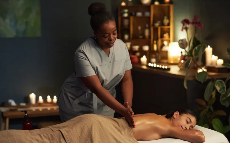This person is geting Thai Massage on a portable Massage bed in his apartnent in dubai.